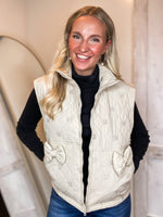 Load image into Gallery viewer, Take The Loop Bow Printed Cream Puffer Vest
