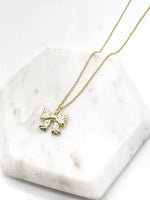 Load image into Gallery viewer, Gold Quilted Bow Necklace Holidays
