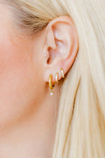 Load image into Gallery viewer, Huggie Earrings - Scarlett Hoop Gold 8mm CZ
