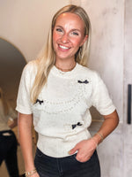 Load image into Gallery viewer, Good To See Pearl Beaded Ivory Bow Sweater
